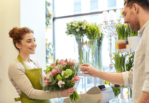 floral shop owner with customer