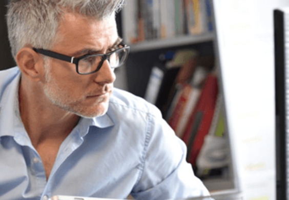 man looking at laptop