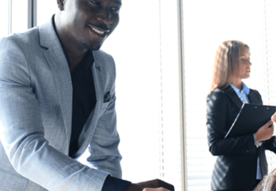 owner shaking hands with clients