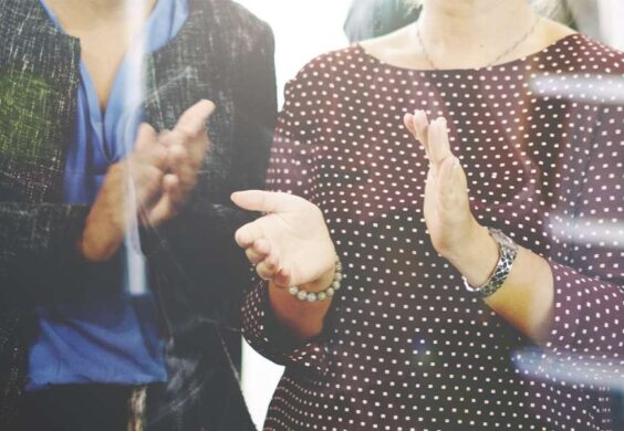 women clapping
