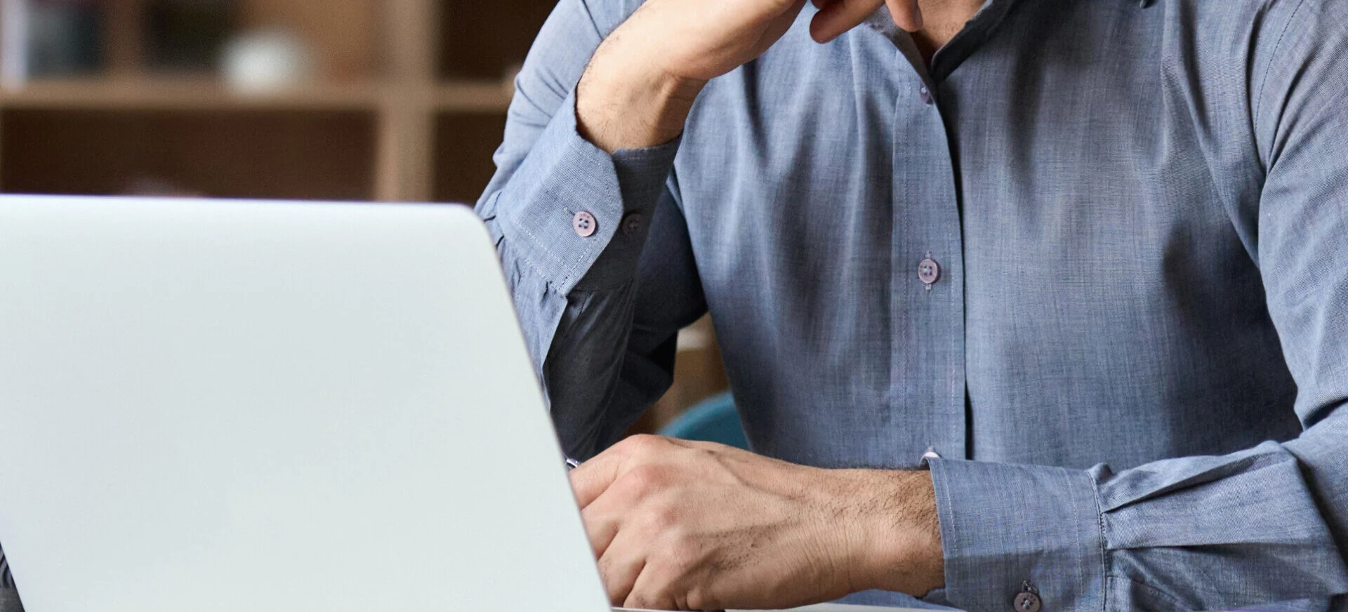 man reviewing faqs about buying a business
