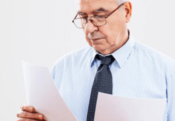 man reviewing paperwork