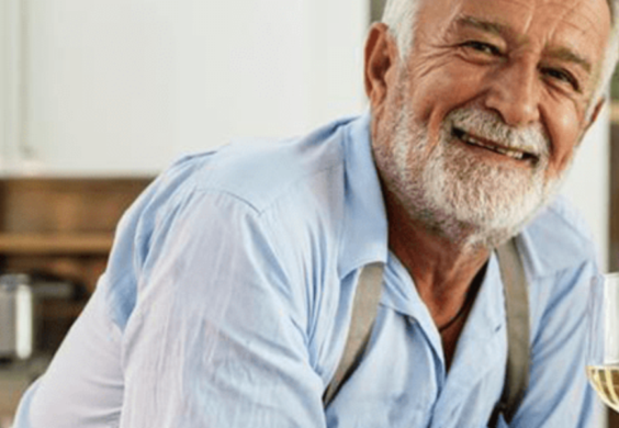 man with glass of wine