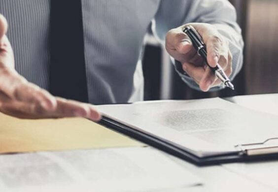 advisor reviewing paperwork with client