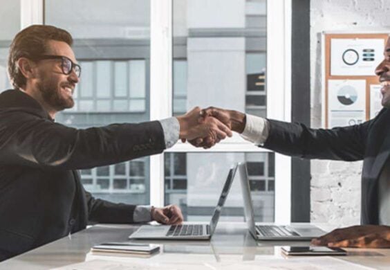 men shaking hands in meeting