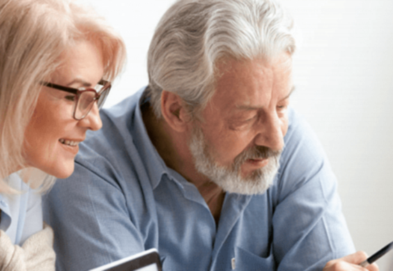 couple meeting with advisor about selling business