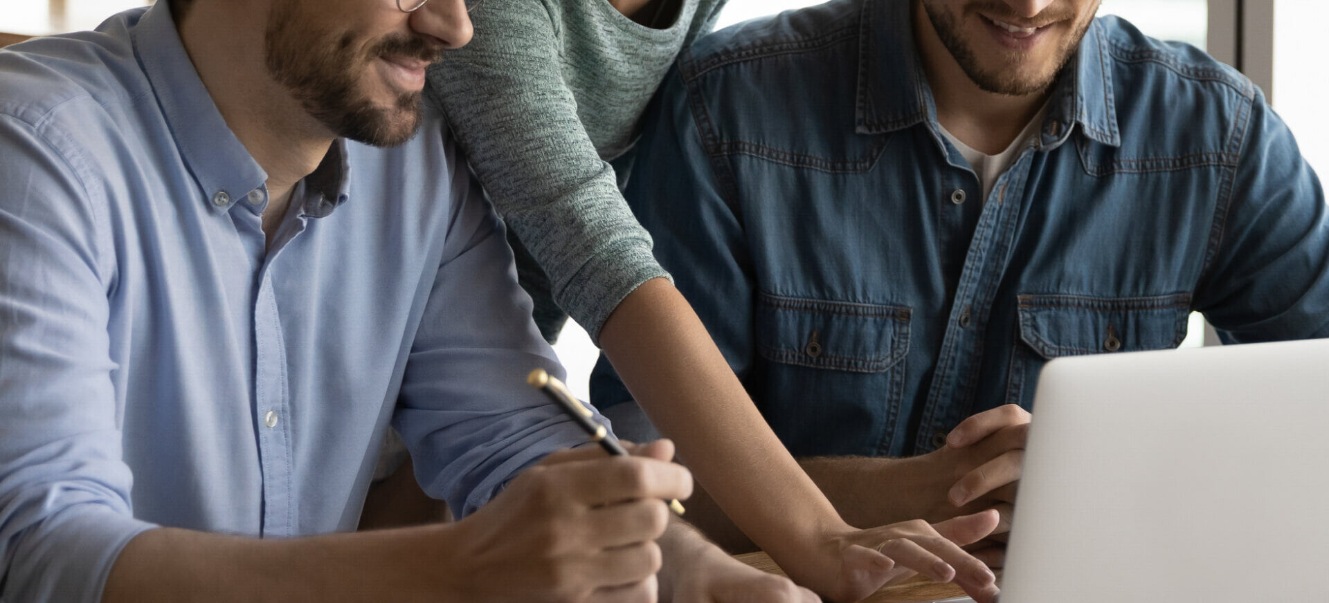 people looking at laptop