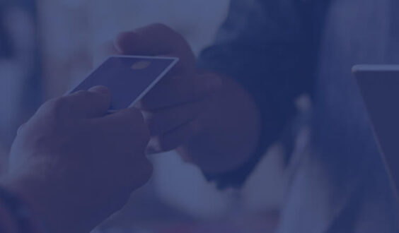 customer handing retail worker their debit card