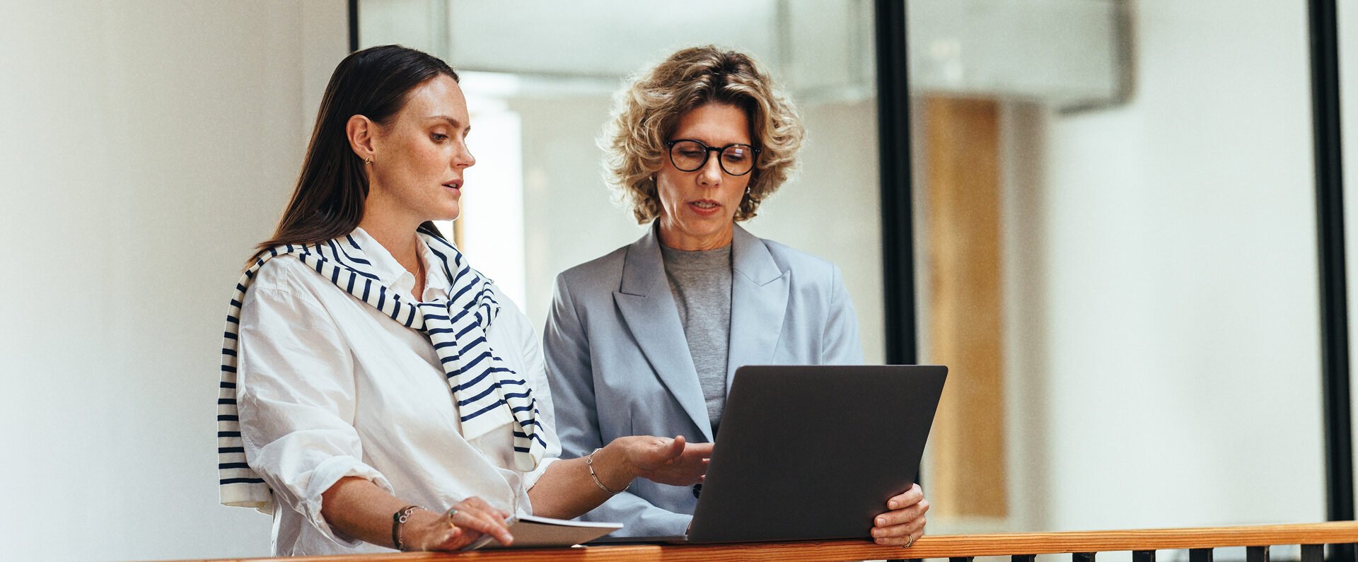 business women reviewing laptop