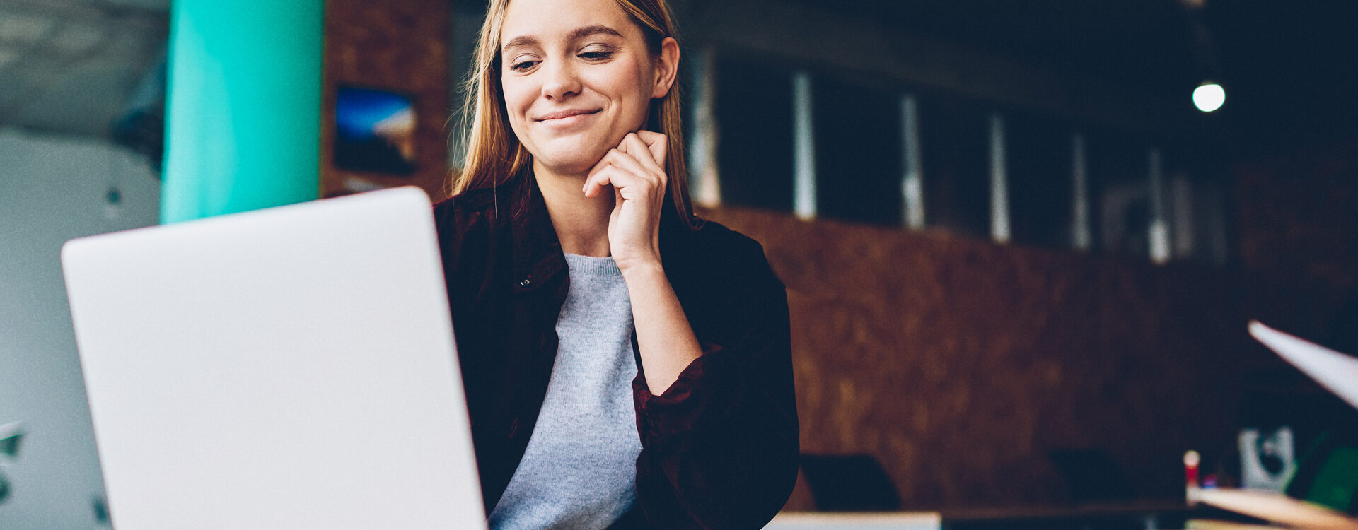 woman looking at laptop