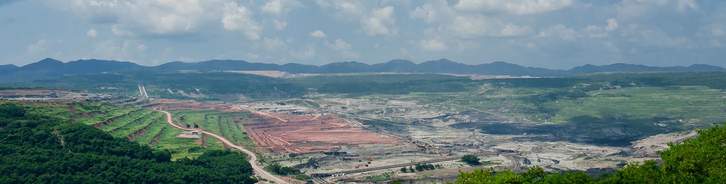 aerial view of town with mountains in the background