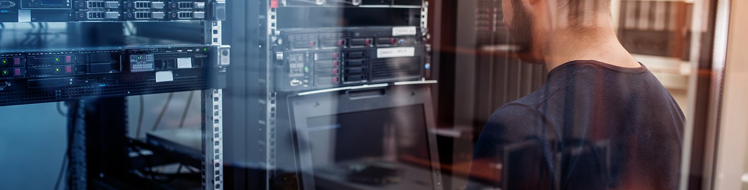 man looking at digital equipment