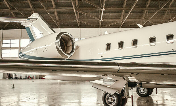 airplane inside of repair facility
