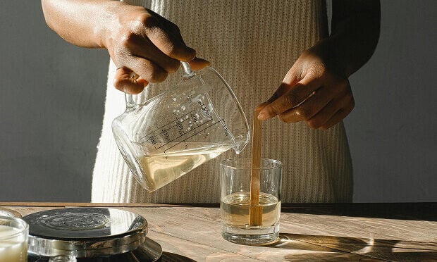 woman measuring liquid