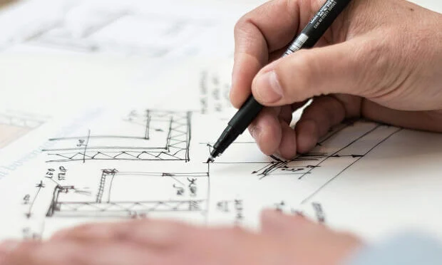 architect drawing dimensions for property