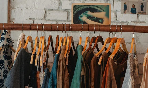 clothing hung on store racks