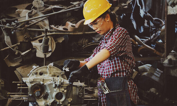 woman operating industrial machine