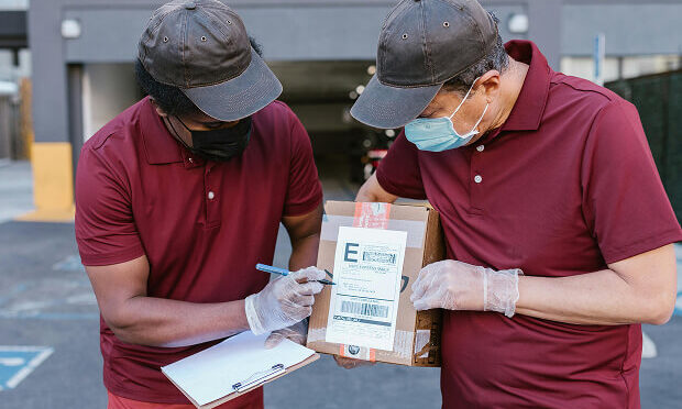 couriers holding package