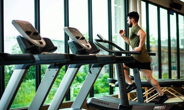 man running on treadmill