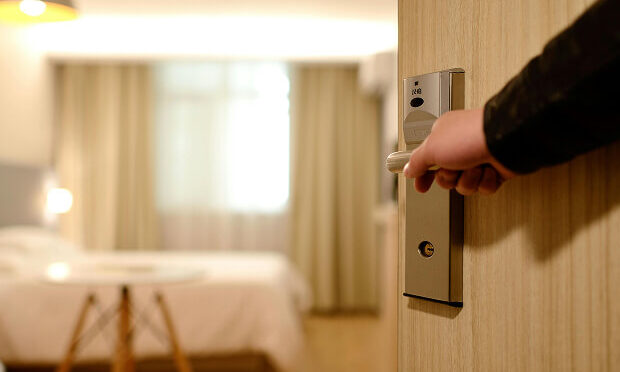 man opening hotel room