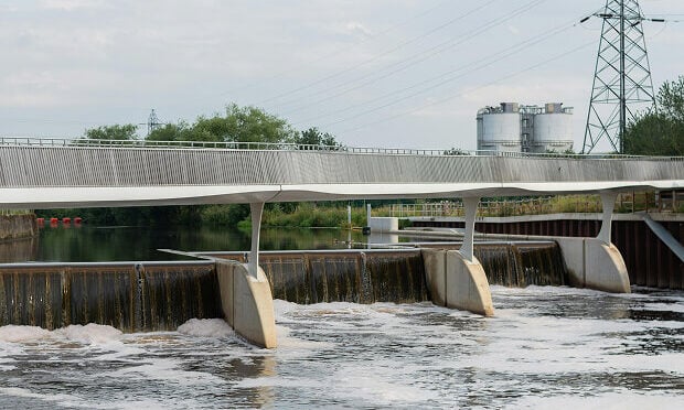 water running off into lower body of water