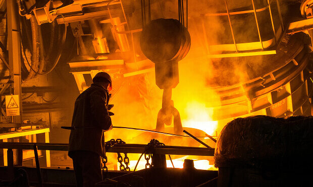 iron worker next to burning iron