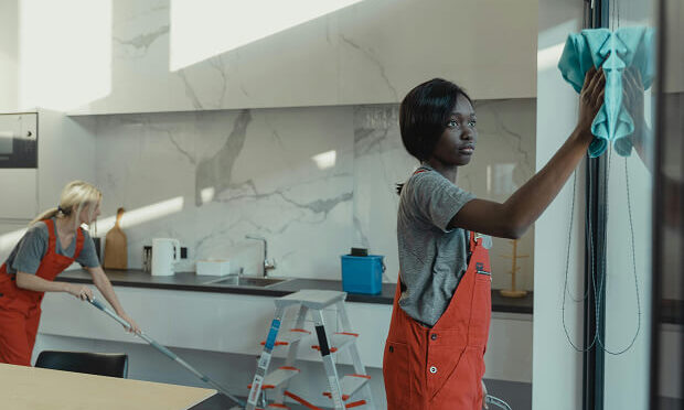 two women cleaning kitchen