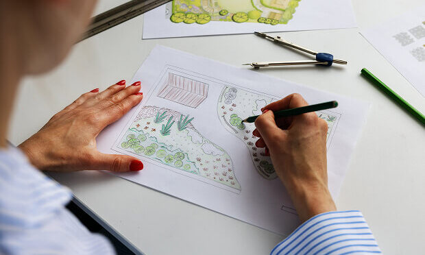 woman drawing garden layout