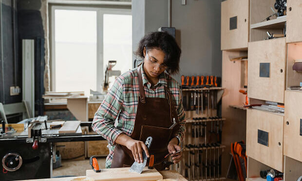 woman completing woodworking project