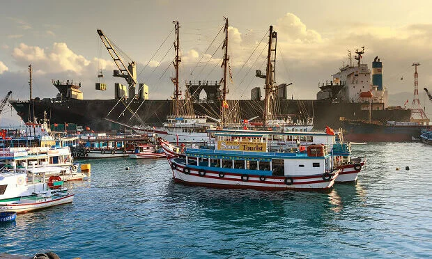 ferries and other boat vessels inside docking area