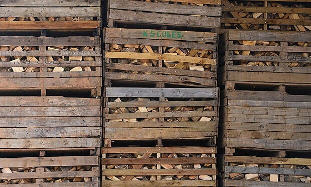 crates of wood pallets stacked on top of each other