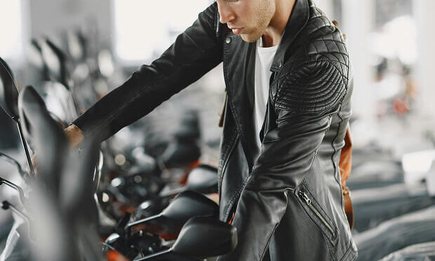 man looking at bike inside shop