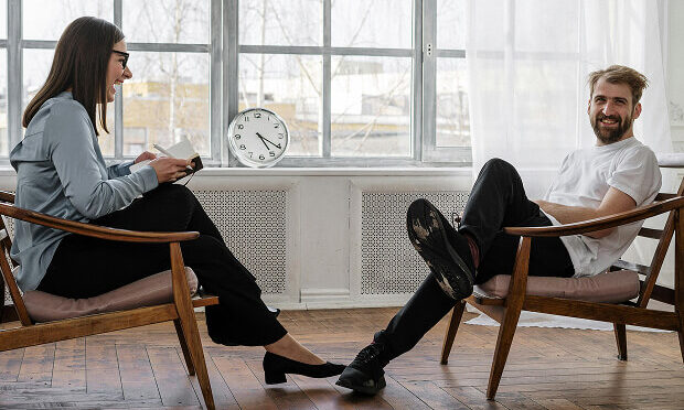 man and woman in one-on-one meeting