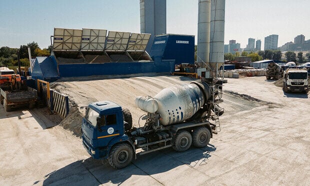 truck laying concrete at job site