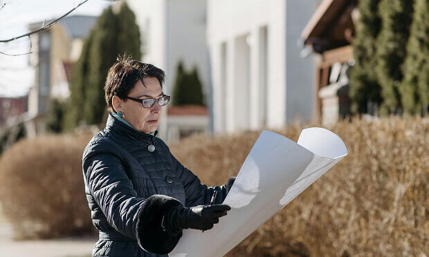 woman reading appraisal document for property