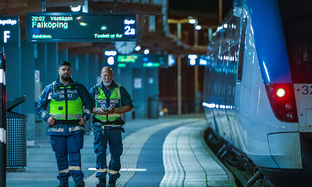 security guards walking past subway