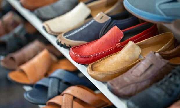 rows of men's loafers and women's sandals