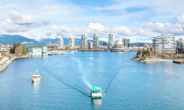 ferry traveling through downtown Vancouver
